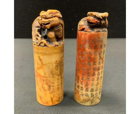 A carved Chinese soapstone seal stamp, decorated with landscape and script, foe dog top, 11.5cm high;  another (2) 