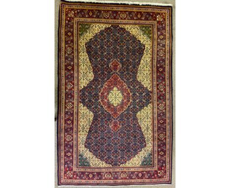 A Persian fine Tabriz woollen carpet, 210cm x 131cm 