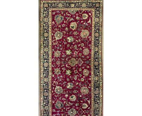 A Persian Kashan woollen rug/carpet, 540cm x 102cm 