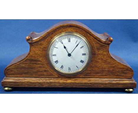 A small Edwardian oak mantle clock with inlaid detail and eight day timepiece, together with an early 19th century mahogany b