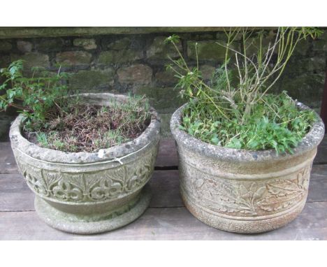 A weathered cast composition stone circular garden planter with repeating acorn and oak leaf relief detail,  45 cm diameter x