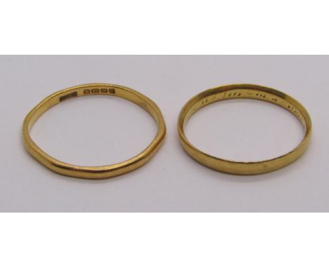 Gold wedding ring with indistinct inscription to interior, possibly a posie ring, size O, 2g and a further 22ct example, size