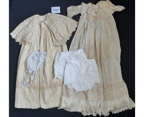 Collection of early 20th century baby textiles including a cream woollen carry cape/coat length 85cm, a long silk gown length