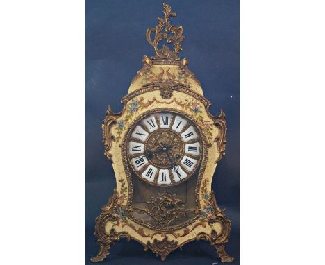 An Italian mantle clock, the timber case with waisted outline and painted and distressed finish, with further applied gilded 