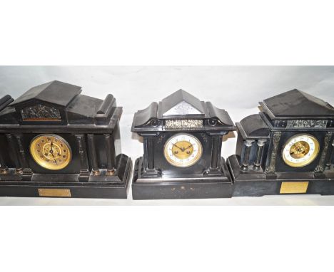 Three Victorian black slate mantle clocks of architectural form all with eight day striking movements 