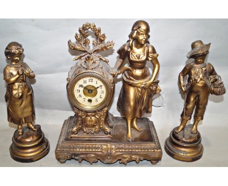 A late 19th century mantle clock in spelter, the eight day timepiece within a shaped frame, to one side a farm girl holding a