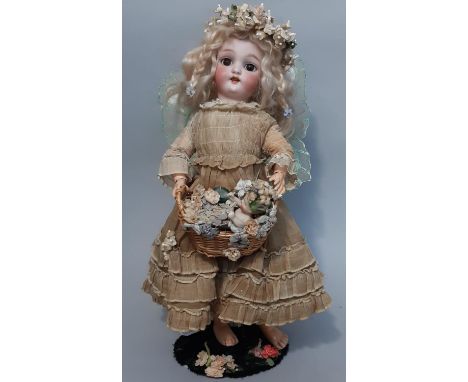 Small German bisque head doll by Simon &amp; Halbig with pierced ears, brown closing eyes and open mouth with teeth, dressed 