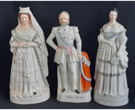 Three 19th century Staffordshire flat-back ceramic figures including King and Queen of Prussia and Queen Victoria, heights 41