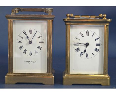 A simple brass carriage clock with eight day movement, retailed by Garrards and a further carriage clock with eight day movem