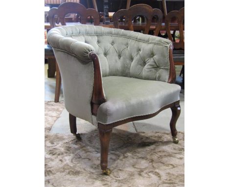 Late Victorian tub chair of small proportions with part show-wood frame, upholstered in green draylon with button back 