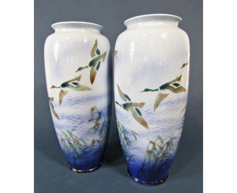 A pair of large Falcon ware ceramic vases decorated with mallards in flight in shades of blue and green, 37cm tall approx, wi