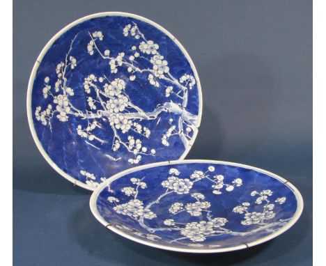 A pair of ceramic wall plates with all over blue and white prunus blossom decoration, 34cm diameter approx 