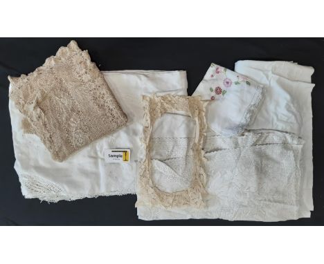 Large collection of vintage textiles including embroidered white table linen, crochet edged cloths, mats, a lace collar, bunt