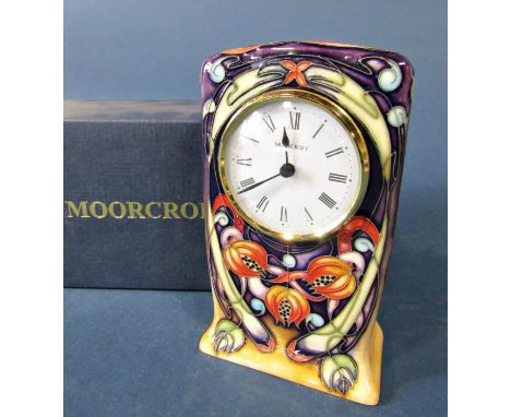A Moorcroft Pottery 'Celtic Web' pattern clock, by Emma Bossons (FRSA) 15cm tall approx, impressed marks to base, with origin