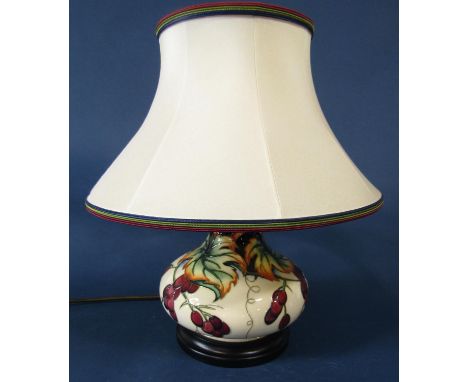 A Moorcroft Pottery 'Provence' pattern lamp, including original Moorcroft lamp shade, the base 19cm (excluding fittings) over