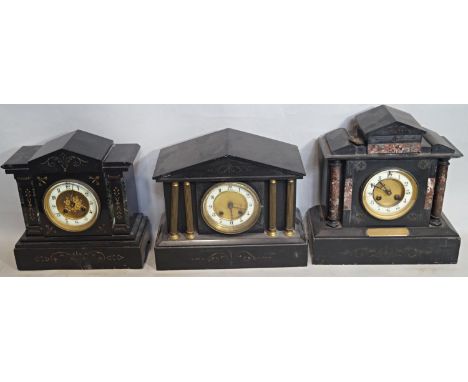 Three Victorian black slate mantle clocks of architectural form all with eight day striking movements 