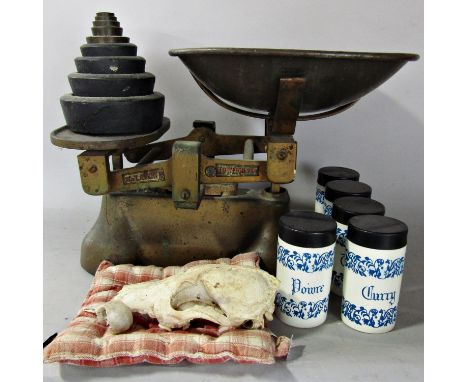 A vintage Avery kitchen scale and a complete set of nine weights, an animals skull and a bird?s skull and some plastic spice 