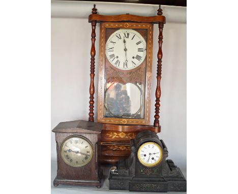 A Victorian black slate mantle clock, a further timber cased mantle clock and a late 19th century walnut mantle clock with st