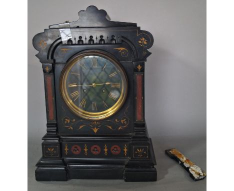 A mid-19th century black slate and marble mantle clock with gothic detail, gilded highlights and eight day striking movement 