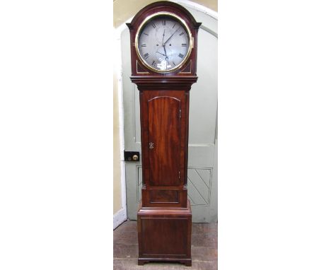 A good Georgian mahogany eight day longcase clock, the trunk enclosing an arched door flanked by reeded and canted corners, t