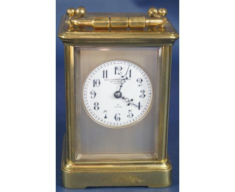A French carriage clock, the eight day movement with strike action, retailed by The Goldsmiths Company, London 