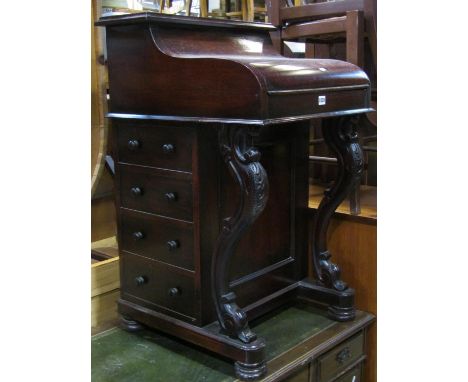 A reproduction mahogany piano top davenport fitted with the usual arrangement of real and dummy drawers beneath a hinged lid 