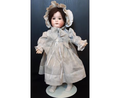 A William Goebel bisque head doll, early 20th century, with brown eyes, open mouth with teeth and jointed composition body, w