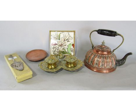 A 19th century copper kettle, a German silver cake slice stamped 800. A hand beaten dish, a double brass inkwell and a single