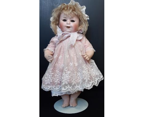 Early 20th century W. Goebel bisque head character doll circa 1910-1915, with blue glass sleeping eyes, open smiling mouth wi