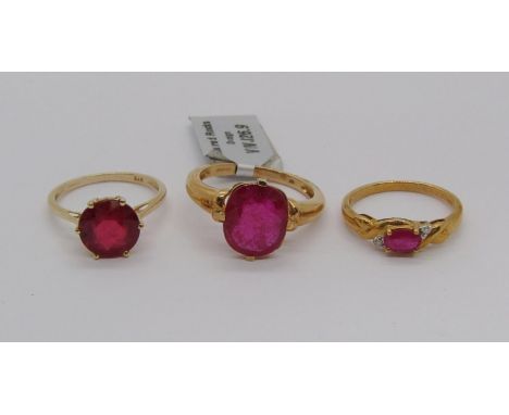 Three 9ct ruby rings to include a crossover type example set with diamonds, sizes N - R, 8.5g total (3) 