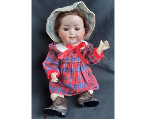 Early 20th century bisque head character doll by William Goebel, with 5 piece bent limb composition body, fixed brown eyes, s