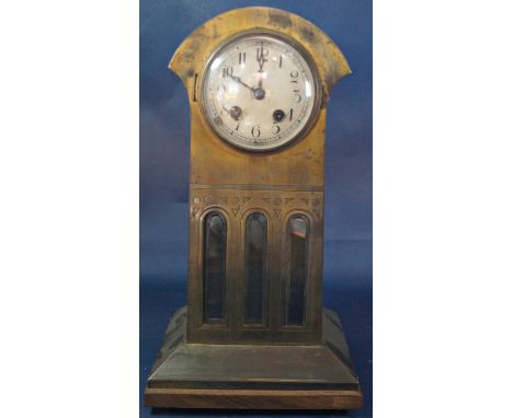 An Arts &amp; Crafts style mantle clock set in an anodised case enclosing three bevelled edge plate glass panels with eight d