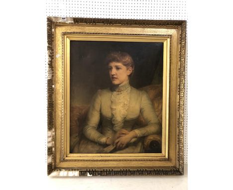 Three-quarter portrait of a woman sitting while holding a book (c.19th Century), oil on canvas, 64 x 77 cm, in an ornate gilt