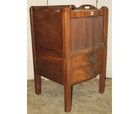 A Georgian mahogany tray top commode with three quarter gallery, the serpentine front enclosed by a sliding tambour door over