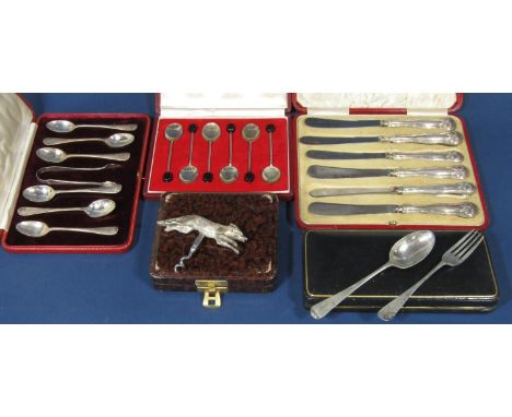 Four cases of silver flatware, six coffee spoons, a spoon and fork set, a set of six teaspoons and sugar tong, six cake knive