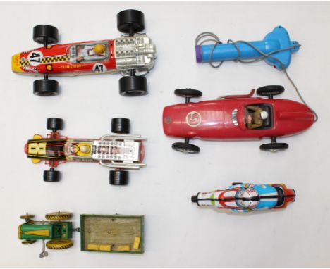 Tinplate: A collection of five unboxed tinplate, friction / battery operated vehicles, to include: Mettoy Tractor and Trailer