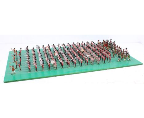 Figures: A wooden board, standing over one hundred hand-painted lead figures of the Mass Band of the British Army. Mostly in 