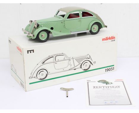 Marklin: A boxed Marklin, Streamlined Car, Reference 19031. Clockwork, tinplate, light green with beige roof. Limited Edition