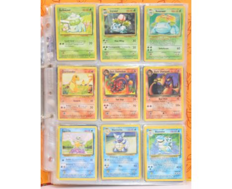 Pokemon: A binder containing a collection of assorted Wizards of the Coast Pokemon cards to include an example of every Pokem