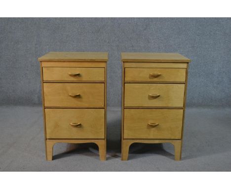 A pair of late 20th century birch veneered plywood bedside chests, probably Scandinavian, with three graduated drawers, on sh