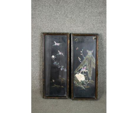 A pair of Chinese black lacquered panels, with applied mother of pearl decoration depicting birds amongst flowers and foliage