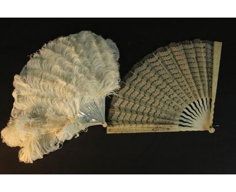 A white ostrich feather and mother of pearl ladies 19th century fan along with a lace and carved bone fan with pierced design