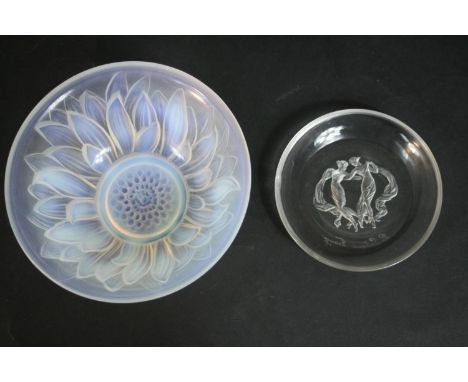 A Lalique circular glass dish, decorated with two Classical dancers, signed R. Lalique, France, together with an Etling opale