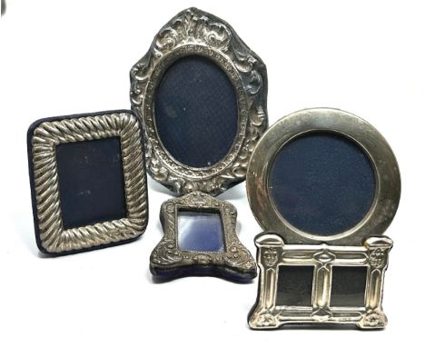 5 small silver picture frames largest measures approx 13cm by 10cm 