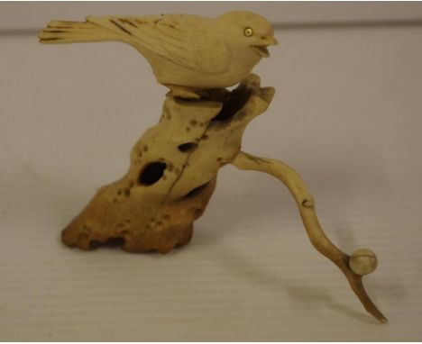 Japanese antique carved ivory bird on a branch, C1920. NB this item may not be exported.