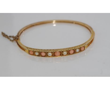 14ct gold pearl and coral bangle weight: approx 10.95 grams