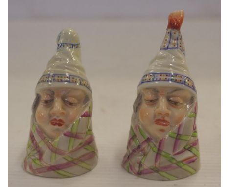 Two Royal Worcester 'Mr Caudle' candle snuffers 7.5cm high approx., circa 1910, one with repaired top