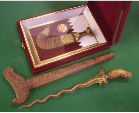 Vintage Kris with dragon decoration 45cm long approx., together with a framed dagger