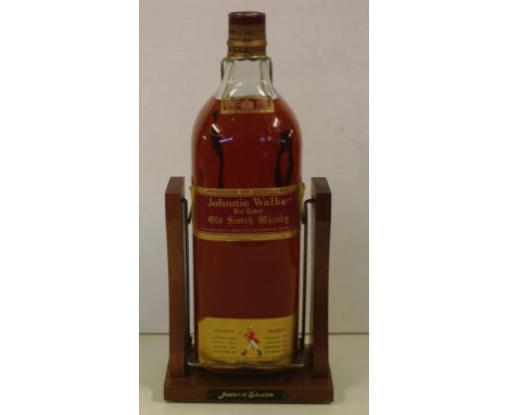 One gallon bottle Johnnie Walker scotch whisky together with timber stand, red label, 160oz