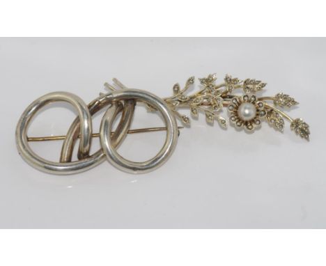 Vintage silver and pearl flower brooch with a silver twist brooch